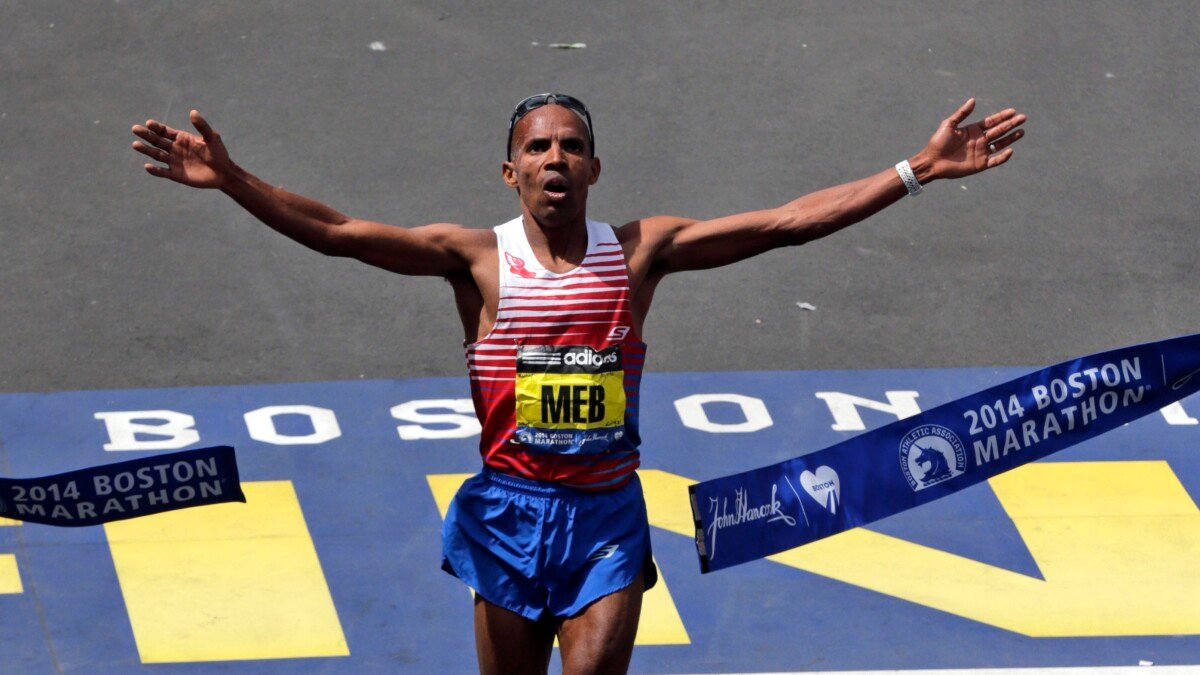 Meb Keflezighi, of San Diego, Calif., breaks the tape to win the 118th Boston Marathon Monday, April 21, 2014 in Boston. (AP Photo/Charles Krupa)